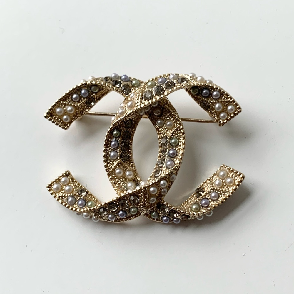 Authentic Chanel brooches pre loved condition